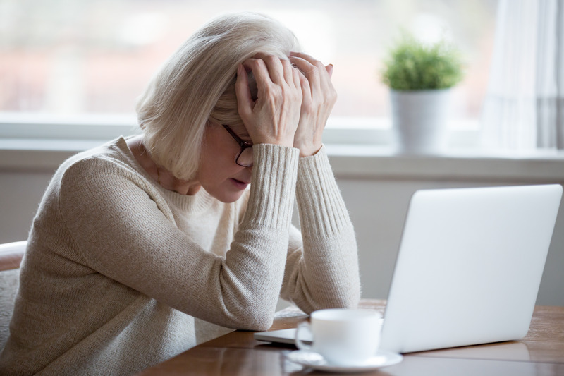 Mom feeling stressed at her desk