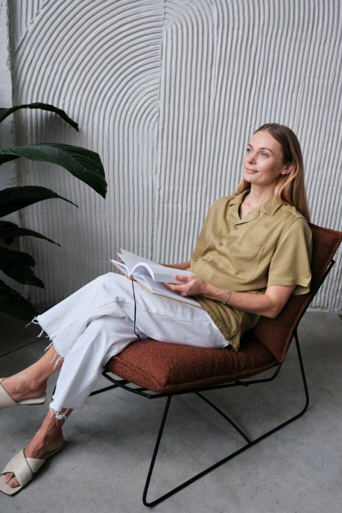 Woman relaxing in a comfortable chair reading