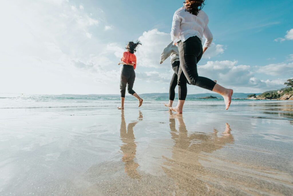 Women jogging along the beach