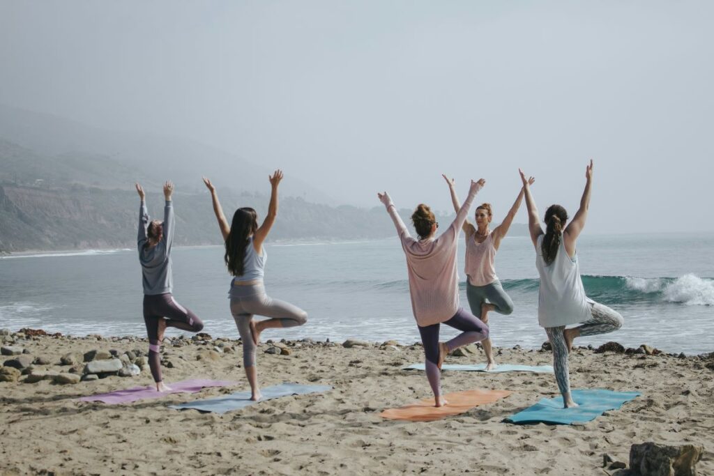 Women doing yoga together to improve the Connect pillar of health