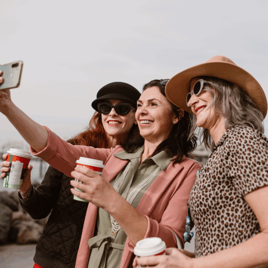 Happy midlife women taking a selfie and feeling confident in their health journey
