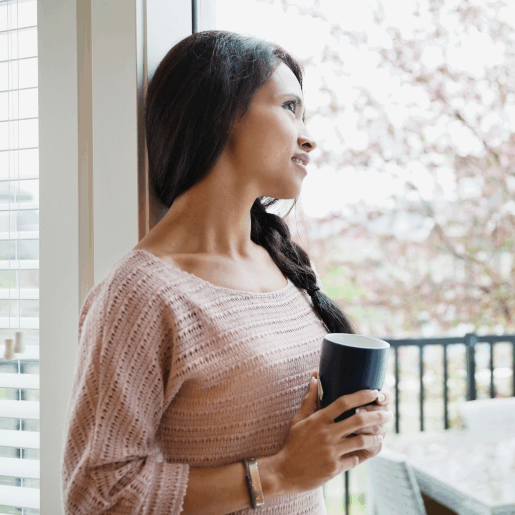 Midlife woman pausing for a moment of calm and clarity.