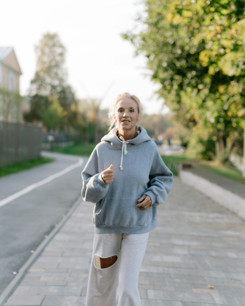 Woman over 40 exercising outdoors to support heart health and hormone balance during menopause