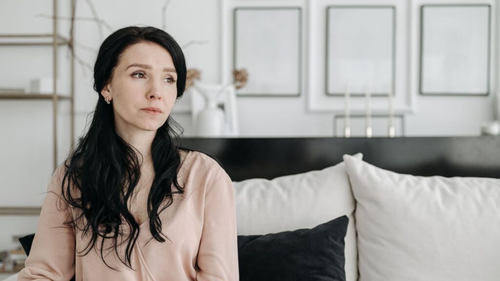 Woman reflecting on emotional wellbeing during perimenopause while experiencing changing hormone symptoms